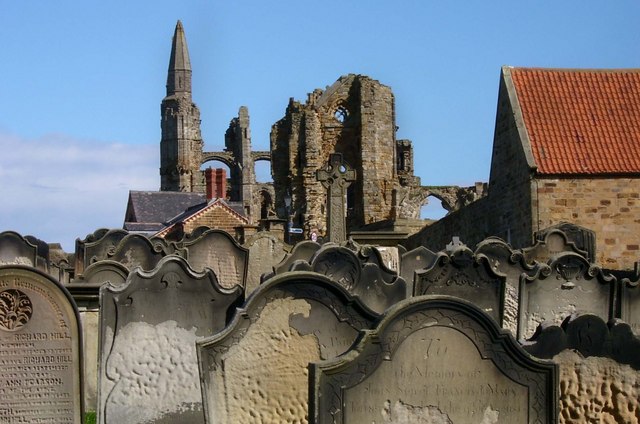 Whitby Abbey beyond gravestones in St Mary's churchyard